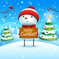 Merry Christmas! Cheerful snowman holds wooden board sign in Christmas snow scene winter landscape. Royalty Free Stock Photo