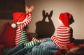 Merry Christmas. children play shadow theater in bed Royalty Free Stock Photo