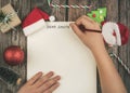 Merry Christmas.Christmas concept background. Child hands writing letter to santa claus Royalty Free Stock Photo