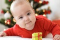 Merry christmas christmas and happy new year, infants, childhood, holidays concept - close-up 6 month old newborn baby Royalty Free Stock Photo