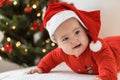Merry christmas christmas and happy new year, infants, childhood, holidays concept - close-up 6 month old newborn baby in santa Royalty Free Stock Photo