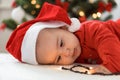 Merry christmas christmas and happy new year, infants, childhood, holidays concept - close-up 6 month old newborn Royalty Free Stock Photo