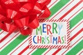 Merry Christmas close up on package with bow Royalty Free Stock Photo