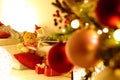 Merry christmas, comfortable living room with lighted tree, decorations and gift packages