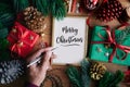 Merry christmas concepts with human hand writing cards with gift box Royalty Free Stock Photo