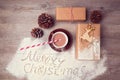 Merry Christmas creative still life with gift boxes and cup of chocolate. View from above Royalty Free Stock Photo