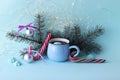Merry Christmas, cup of coffee, meringues, festive decor, illumination, mint color background