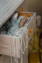 Merry Christmas decorated interior details. Drawer with shiny pine cone toy, pearl beads, artificial snow. Happy winter holidays,