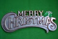 Merry Christmas on green background.