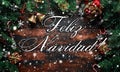 Merry Christmas displayed on a rustic wooden table with decoration, gifts, snow, tree branch in Spain Royalty Free Stock Photo