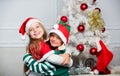 Merry christmas. Family holiday tradition. Children cheerful celebrate christmas. Kids christmas costumes santa and elf Royalty Free Stock Photo