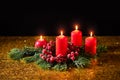 Merry Christmas. Four red burning candles and fir branches