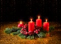 Merry Christmas. Four red burning candles and fir branches