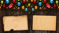 Merry Christmas Frame with real wood green pine, colorful baubles, gift boxe and other seasonal stuff over an old wooden aged back Royalty Free Stock Photo