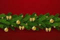 Merry Christmas garland isolated red background. 3D green branch holiday hanging decor. Invitation ornament. Pine tree Royalty Free Stock Photo