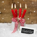 Merry Christmas in German language with four red c Royalty Free Stock Photo
