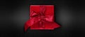 Merry christmas gift red box with ribbon bow, isolated on black background, top view and copy space template, layout useful for Royalty Free Stock Photo
