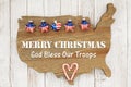 Merry Christmas God bless our troops greeting with stars on weathered wood USA map