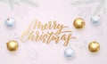 Merry Christmas golden calligraphy lettering, Xmas gold and silver balls on snowflakes pattern. Vector Xmas holiday sparkling orna Royalty Free Stock Photo