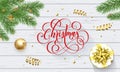 Merry Christmas golden decoration and calligraphy font on white wooden background for greeting card. Vector Christmas or New Year Royalty Free Stock Photo