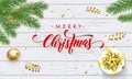Merry Christmas golden decoration, greeting card calligraphy font on white wooden background. Vector Christmas tree and New Year g Royalty Free Stock Photo