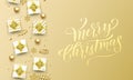 Merry Christmas golden greeting card premium background. Vector Christmas calligraphy lettering emboss with gifts, snowflakes a Royalty Free Stock Photo