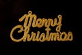 Merry Christmas golden text on a black background