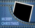 Merry Christmas greeting and blank photo frame in blue jeans pocket Royalty Free Stock Photo