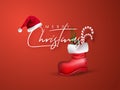Merry Christmas greeting card design with santa hat and candy cane, pine leaves in red boot. Royalty Free Stock Photo