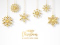Merry Christmas greeting card with hanging glitter snowflakes and hand lettering. Bright gold baubles on white Royalty Free Stock Photo