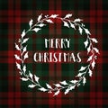 Merry Christmas greeting card, invitation. White Christmas wreath made of holly. Hand lettered text. Tartan checkered plaid.