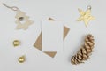 Merry christmas greeting lettering.Christmas holiday decorations balls, christmas tree, golden star and big pine cone.