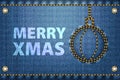 Merry Christmas greetings on blue jeans background. Royalty Free Stock Photo