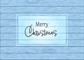 Merry Christmas greetings on a wooden background Royalty Free Stock Photo