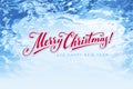 Merry Christmas hand drawn lettering on blue ice background Royalty Free Stock Photo