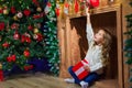 Merry Christmas happy girl with magic gift at home near Christma Royalty Free Stock Photo