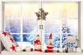 Merry Christmas and Happy Holidays! A beautiful decorated for Christmas window. Winter forest from the window of the house. Royalty Free Stock Photo