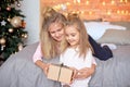 Merry Christmas and Happy Holidays.Cheerful cute children opening gifts. Kids having fun near tree in the morning Royalty Free Stock Photo