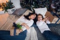 Merry Christmas and Happy Holidays. Cheerful mom and her cute daughter girl exchanging gifts. Parent and little child Royalty Free Stock Photo