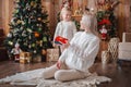 Cheerful mom and her cute daughter girl exchanging gifts Royalty Free Stock Photo