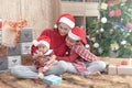 Merry Christmas and Happy Holidays! Cheerful mom and her cute daughters playing and have fun together