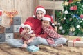 Merry Christmas and Happy Holidays! Cheerful mom and her cute daughters playing and have fun together Royalty Free Stock Photo