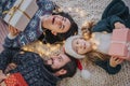 Merry Christmas and Happy Holidays Cheerful Mother, father and her cute daughter girl exchanging gifts. Parent and Royalty Free Stock Photo