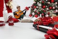 Merry christmas and happy holidays, children play guitar and tambourine near the christmas tree with wrapped gift packages and Royalty Free Stock Photo