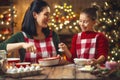 Family cooking Christmas cookies. Royalty Free Stock Photo