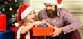 Merry Christmas and Happy Holidays. Father with daughter celebrating christmas. Dad and child open christmas gift Royalty Free Stock Photo