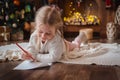 Little child girl writes letter Santa Claus and dreams of a gift background Royalty Free Stock Photo