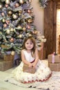 Merry Christmas and happy holidays! New Year 2020. Happy little girl with christmas present at home. kid holds gift box near Chris Royalty Free Stock Photo