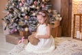 Merry Christmas and happy holidays! New Year 2020. Happy little girl with christmas present at home. kid holds gift box near Chris Royalty Free Stock Photo