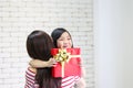 Merry Christmas and Happy Holidays or Happy New year. Mom gives gifts to children. Cute girl gives his beloved mother a gift. New